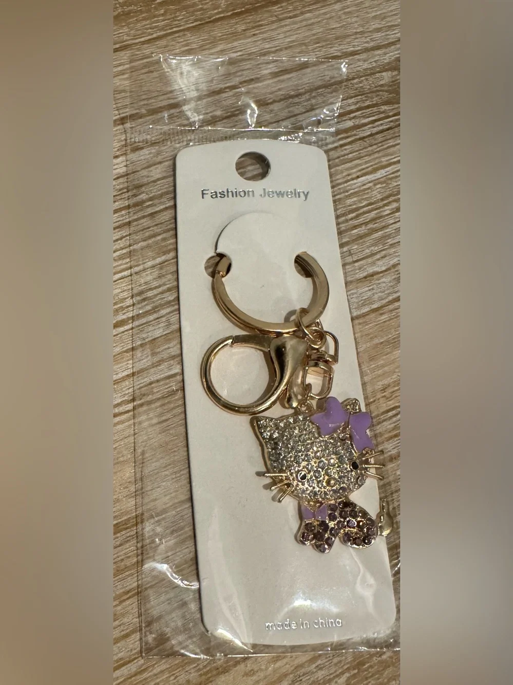 Gold-tone Cat Keychain or Bag Charm with Purple Accents